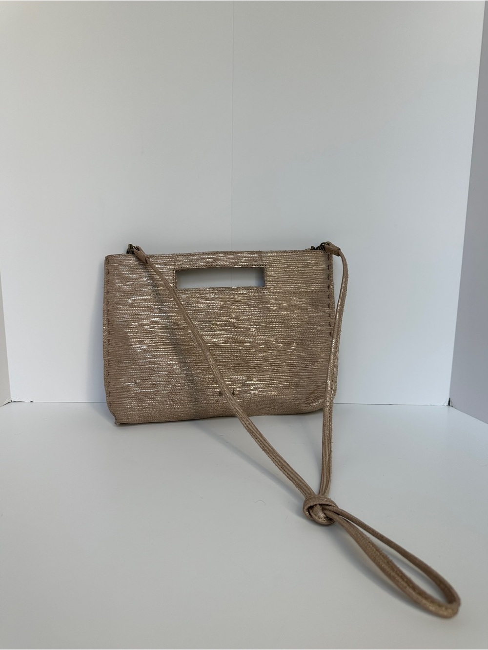The Sak Metallic Gold-Tone Crossbody Clutch with Cutout Handle